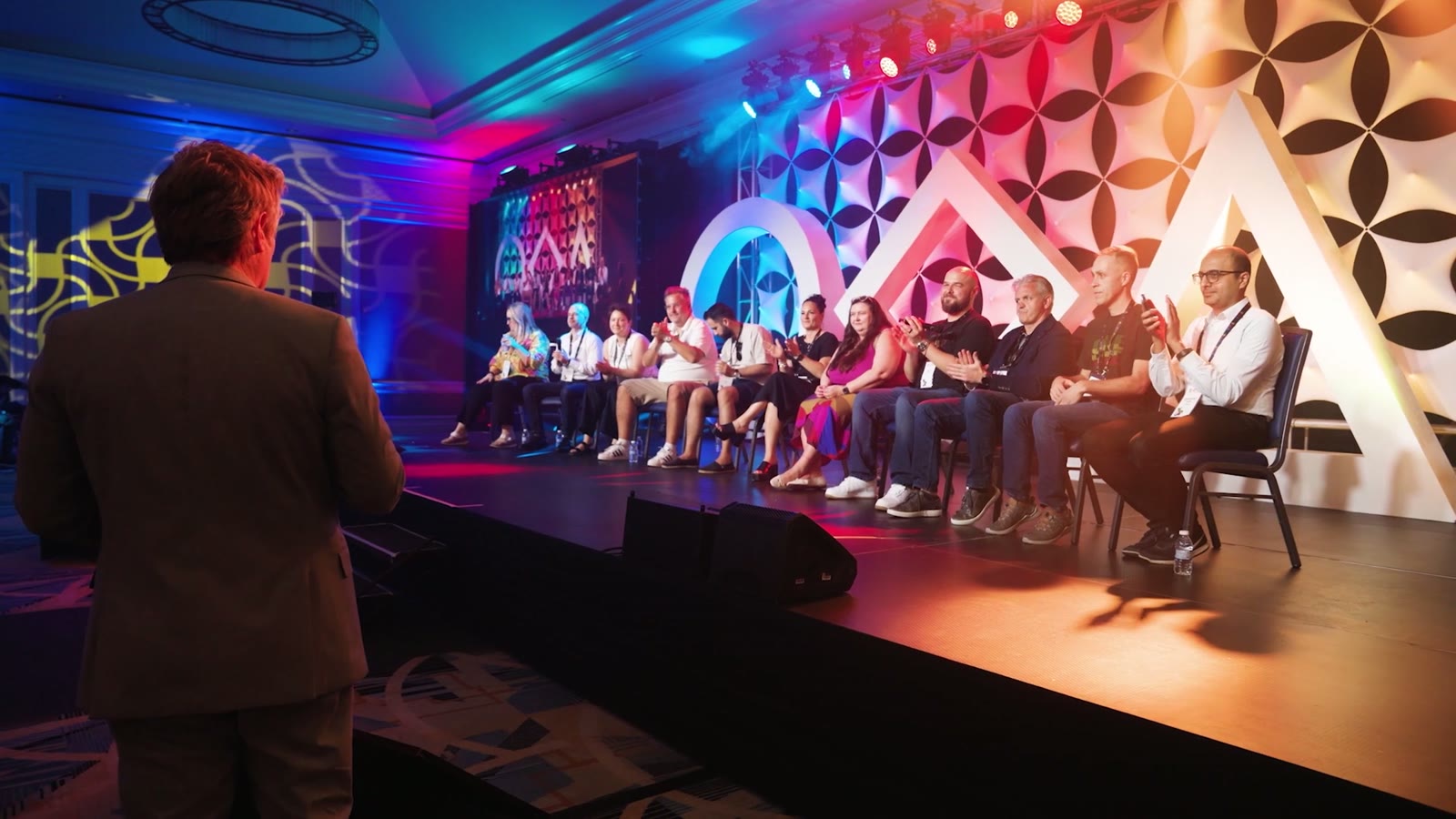 [CONFIRM] Panel session on a branded event stage.