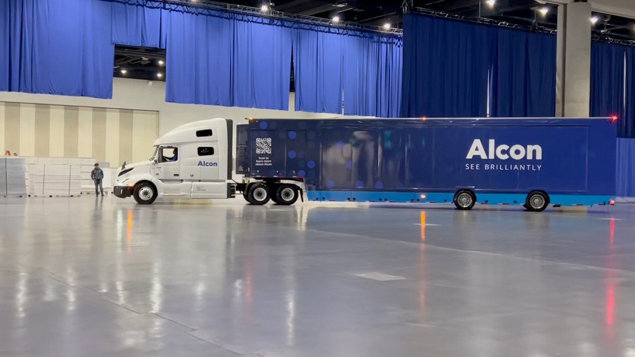 [CONFIRM] The Suite Spot trailer parked inside the exhibition hall.