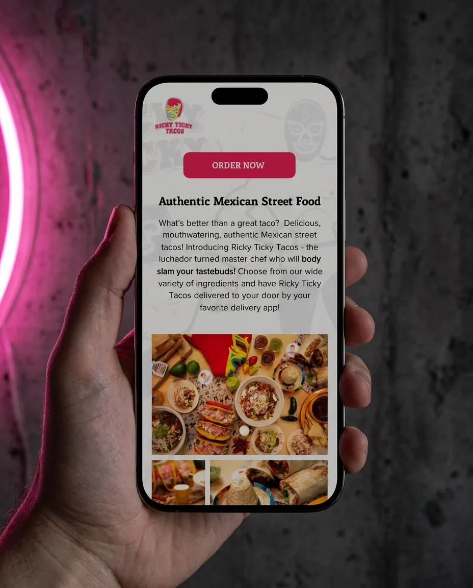 The mobile version of the Ricky Ticky Tacos site held in one hand under pink neon.